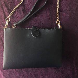 Black purse with gold chain
